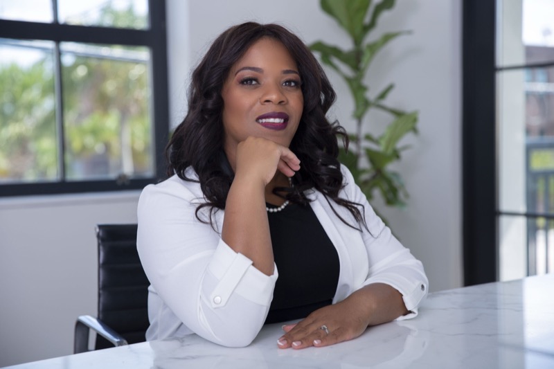 Kia at her desk, ready to review your case